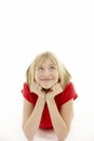 Young Girl Lying On Stomach In Studio Royalty Free Stock Photo