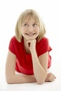 Young Girl Lying On Stomach In Studio Royalty Free Stock Photo