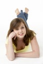 Young Girl Lying On Stomach In Studio