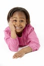 Young Girl Lying On Stomach In Studio Royalty Free Stock Photo