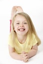 Young Girl Lying On Stomach In Studio Royalty Free Stock Photo