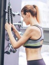 Young girl makes exercises at the gym