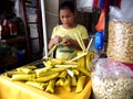 A young girl makes suman