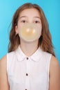 Young girl making a big bubble with a chewing gum Royalty Free Stock Photo