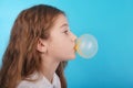 Young girl making a big bubble with a chewing gum Royalty Free Stock Photo