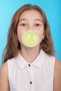 Young girl making a big bubble with a chewing gum Royalty Free Stock Photo