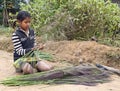 Young Girl Making Brooms