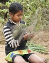 Young Girl Making Brooms