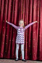 Young girl making her entrance on stage Royalty Free Stock Photo