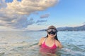 Young girl with mask exploring underwater. Kids snorkel swimming. Snorkeling diving child Royalty Free Stock Photo