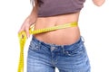 Young girl measuring her waist and being happy Royalty Free Stock Photo