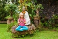 Young girl meditating in yoga lotus pose with namaste hands Royalty Free Stock Photo