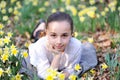 Young girl in the middle of daffodils Royalty Free Stock Photo