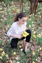 Young girl in the middle of daffodils Royalty Free Stock Photo