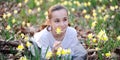 Young girl in the middle of daffodils Royalty Free Stock Photo