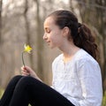 Young girl in the middle of daffodils Royalty Free Stock Photo