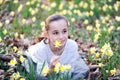 Young girl in the middle of daffodils Royalty Free Stock Photo