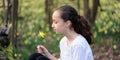 Young girl in the middle of daffodils Royalty Free Stock Photo