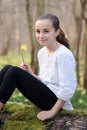 Young girl in the middle of daffodils Royalty Free Stock Photo