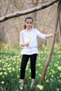 Young girl in the middle of daffodils Royalty Free Stock Photo