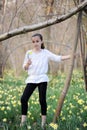 Young girl in the middle of daffodils Royalty Free Stock Photo