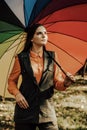 Young girl with multicoloured umbrella