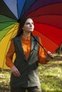 Young girl with multicoloured umbrella