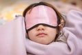 Young Girl Naps with an Eye Patch and a Cozy Blanket Royalty Free Stock Photo