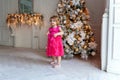 Young girl near a Christmas tree Royalty Free Stock Photo