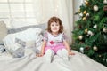 Young girl near a Christmas tree Royalty Free Stock Photo