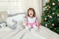 Young girl near a Christmas tree Royalty Free Stock Photo