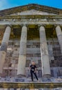 A young girl near the temple of Garni pagan, a Greek temple in the Republic of Armenia. May 3, 2019. Royalty Free Stock Photo