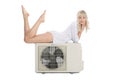 Young girl with a new air conditioner Royalty Free Stock Photo