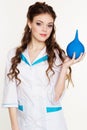 Young girl nurse with blue lavement in hands Royalty Free Stock Photo