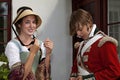 Young redcoat soldier in love talking to a young woman
