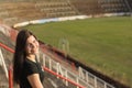 Young girl in old fotball stadium