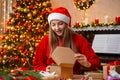 Young girl opens Christmas present Royalty Free Stock Photo
