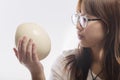 Young girl with ostrich egg in own hand Royalty Free Stock Photo