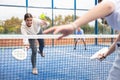 Young girl paddle tennis player performing forehand