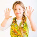 Young girl with paint on hands