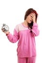 Young girl panicking holding an alarm clock Royalty Free Stock Photo