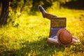 Young girl in the park working with laptop Royalty Free Stock Photo