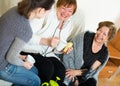 Young girl paying visit to senior grandmothers Royalty Free Stock Photo