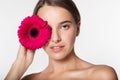 Young girl with perfect skin and red flower Royalty Free Stock Photo