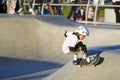 Young Girl Performing At Skateboard Park