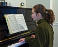 young girl, piano and book