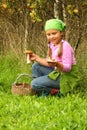 Young girl picking mushrooms Royalty Free Stock Photo