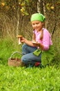 Young girl picking mushrooms