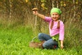 Young girl picking mushrooms