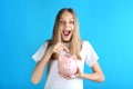 Young girl with piggy bank